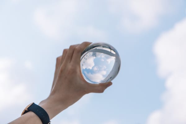 crop male holding glass bulb in hand